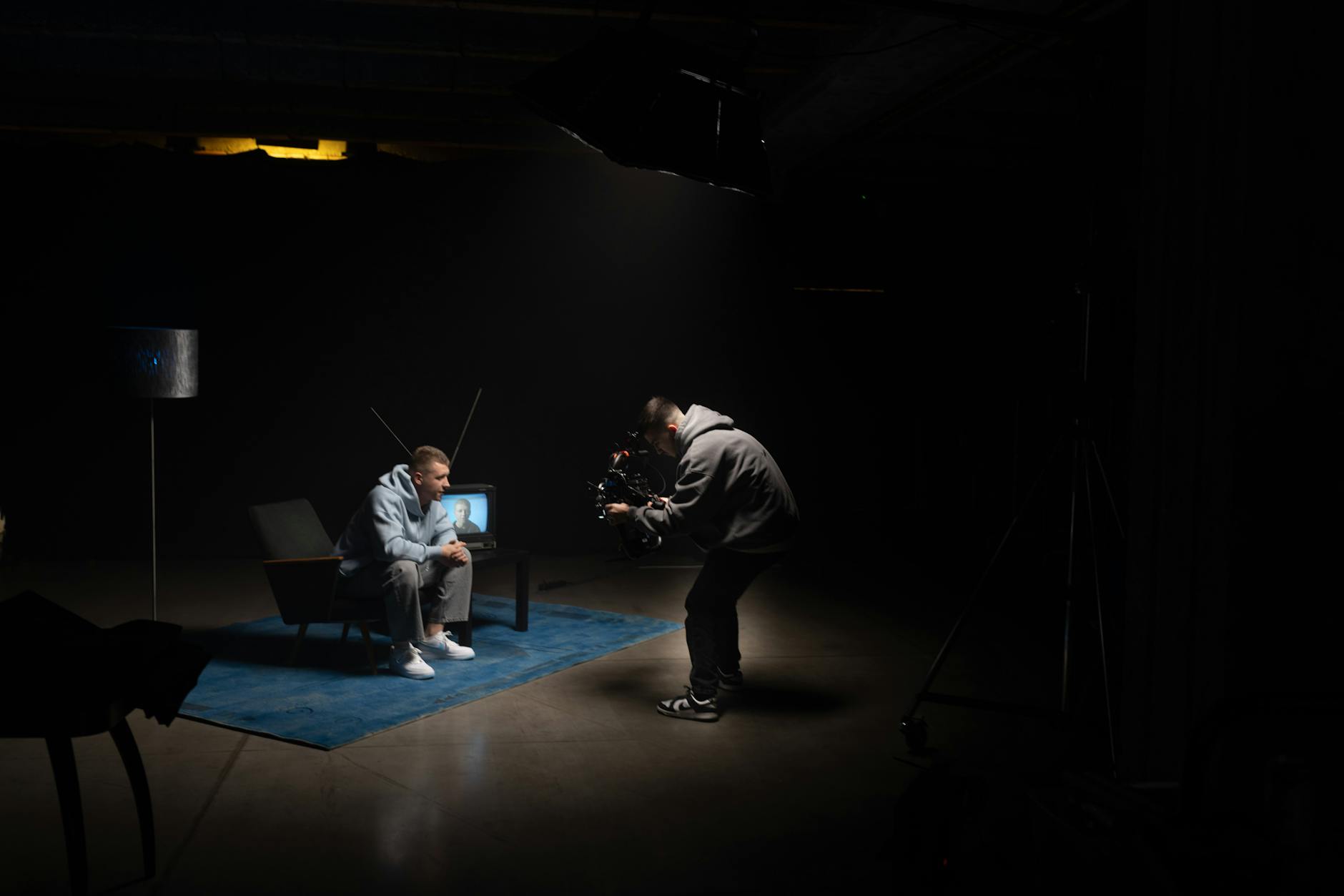 Empty television studio with professional lighting and camera equipment