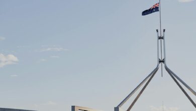 State government building with American flag, representing gubernatorial leadership and political authority