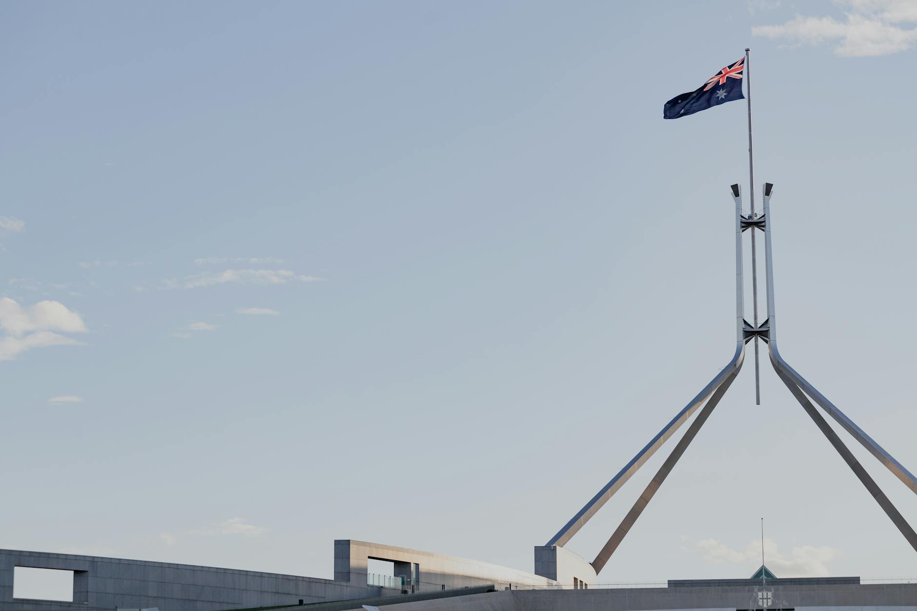 State government building with American flag, representing gubernatorial leadership and political authority
