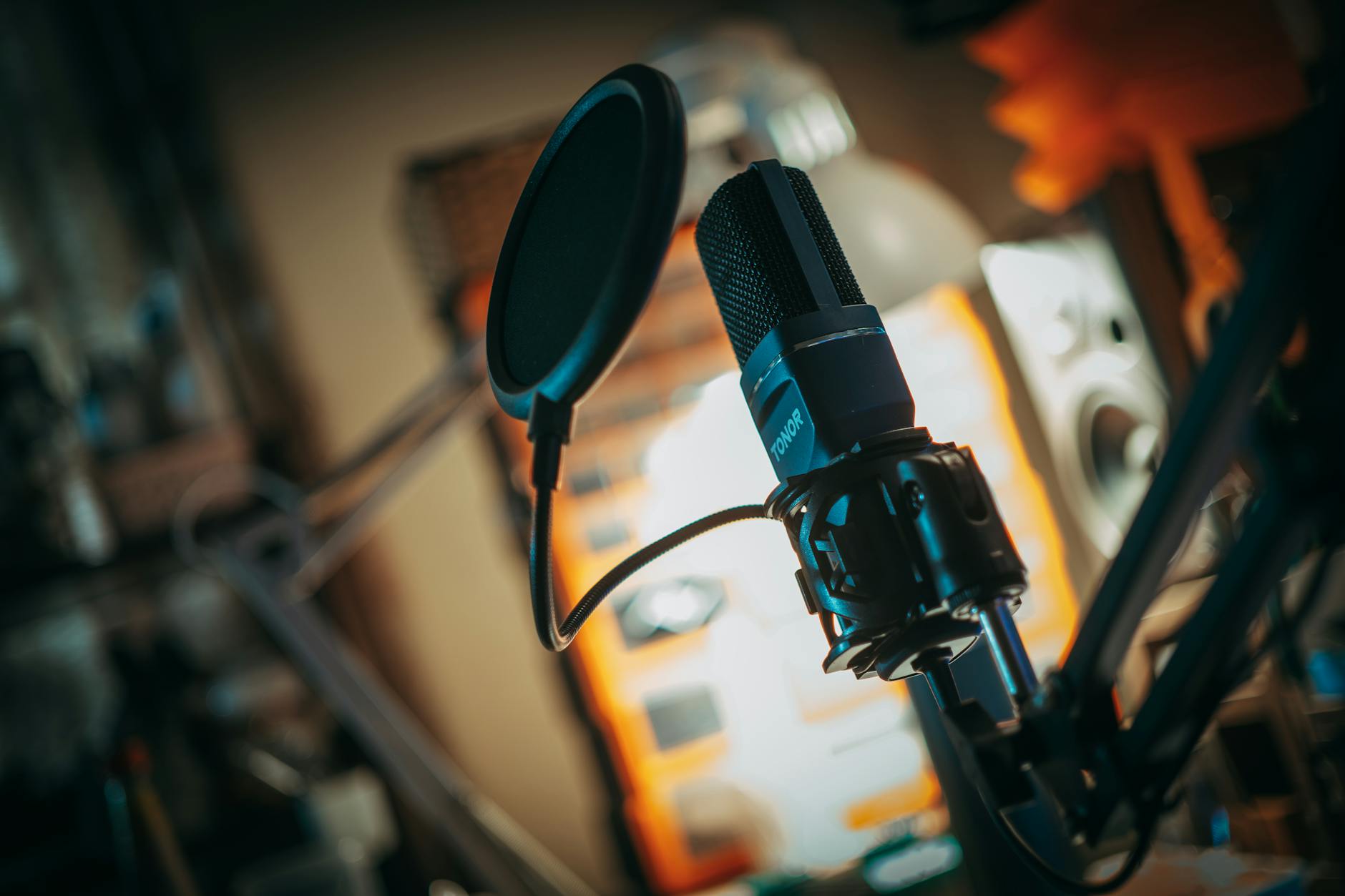 Professional podcast recording setup with microphone and audio equipment in studio environment