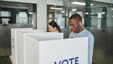 Voters casting ballots at polling station during primary election