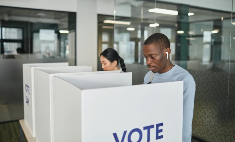 Voters casting ballots at polling station during primary election
