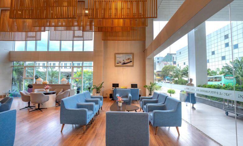 Modern hotel lobby interior with seating areas and reception desk
