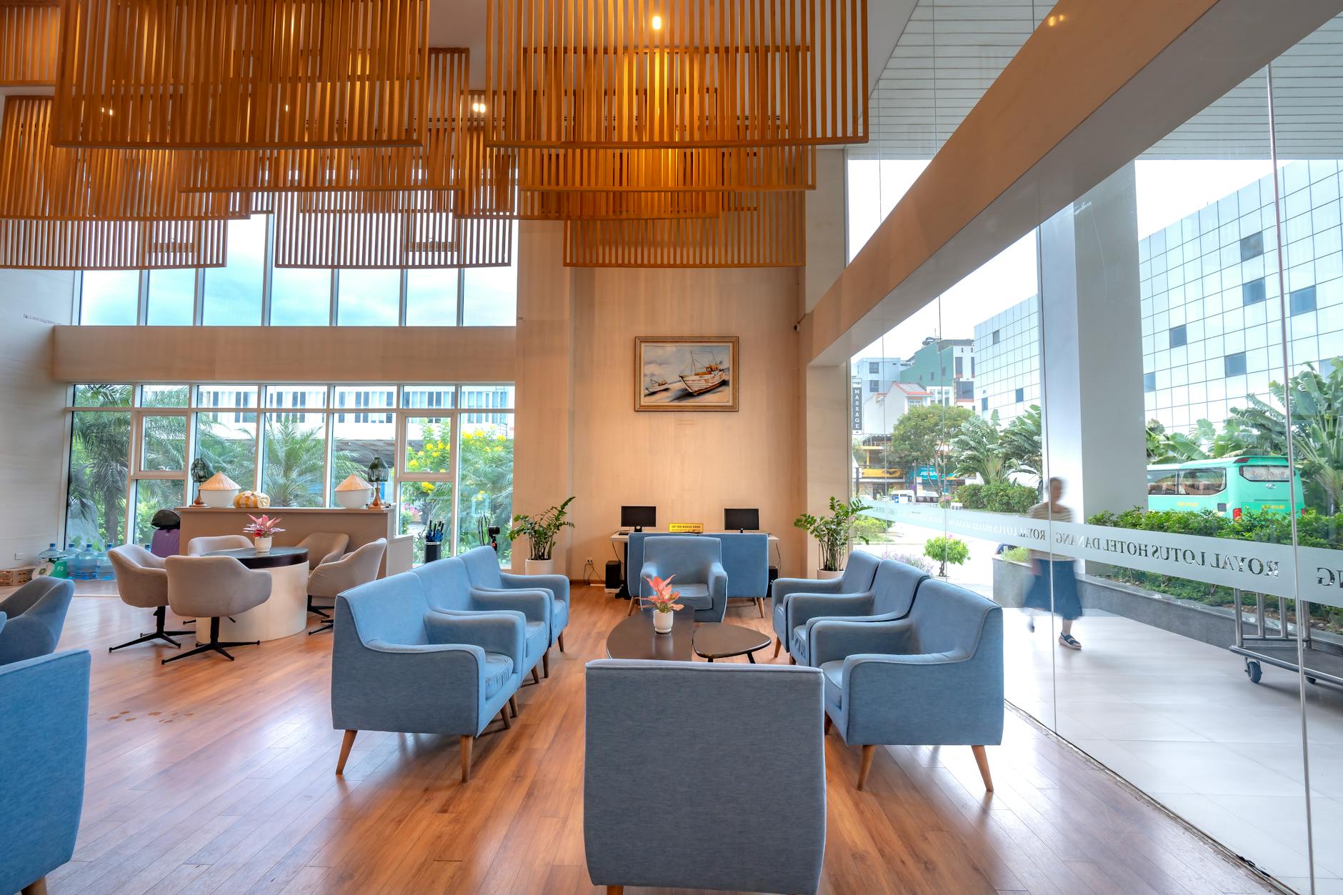 Modern hotel lobby interior with seating areas and reception desk