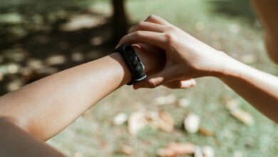 Person wearing fitness tracker on wrist showing sleep monitoring interface