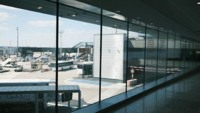Modern airport terminal interior with travelers walking through departure area