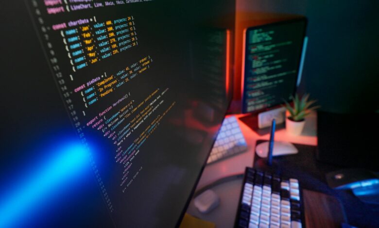 Modern newsroom with computers and monitors showing local news coverage and social media feeds