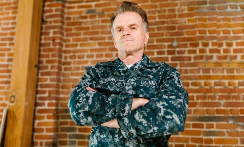 Professional headshot of a military veteran in business attire