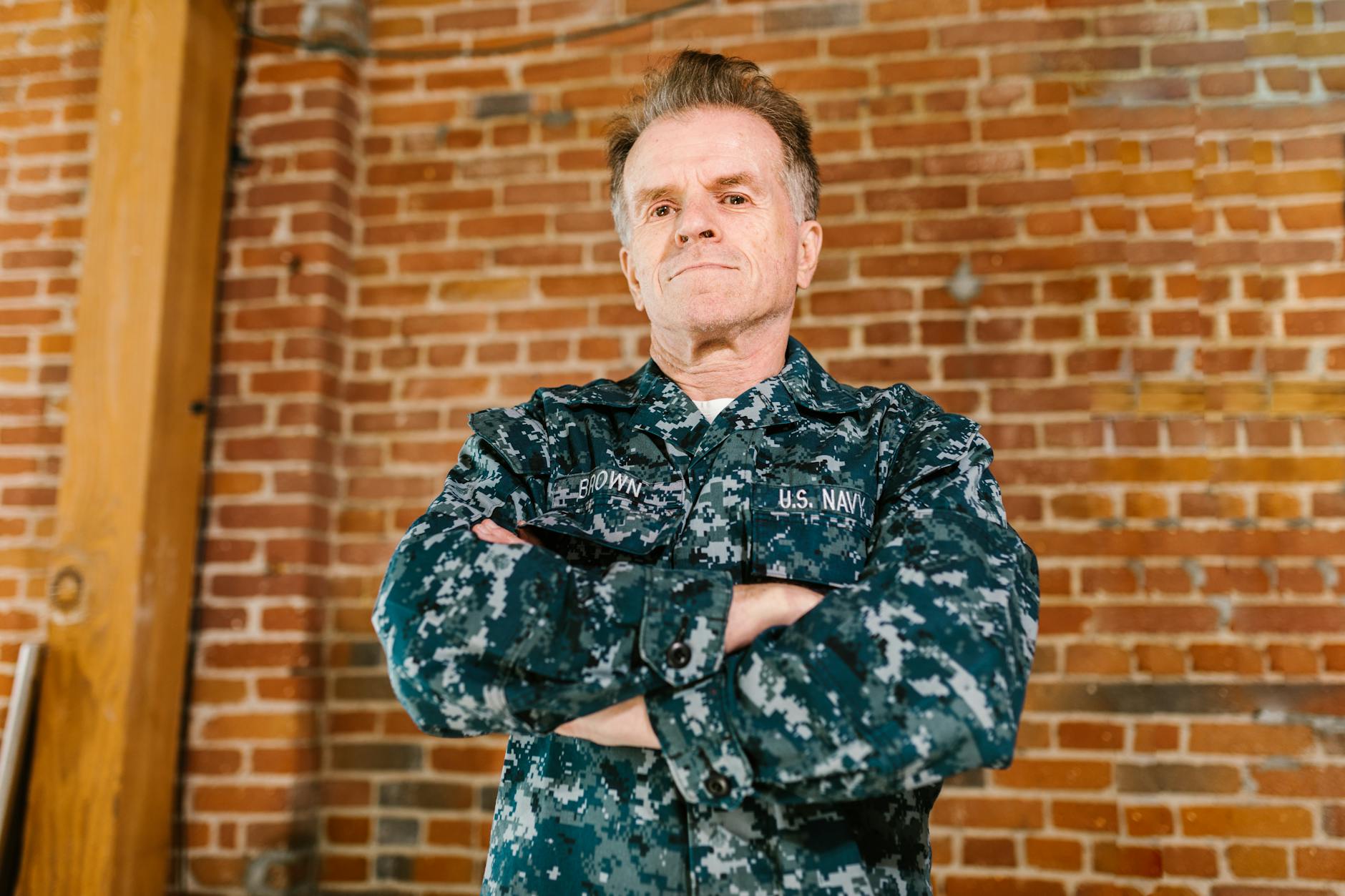 Professional headshot of a military veteran in business attire