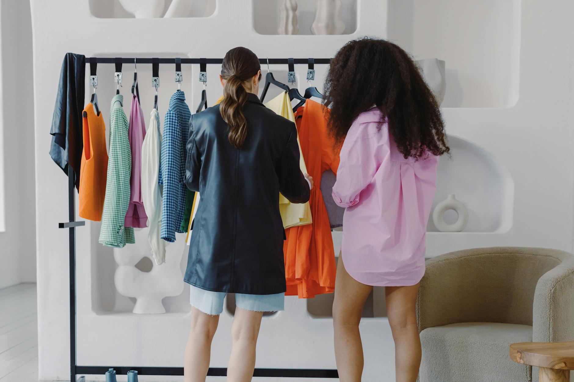 Colorful clothing rack displaying various garments in a retail setting