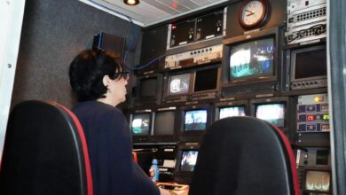 Modern television broadcasting studio with professional lighting and camera equipment