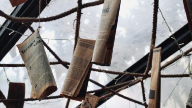 Large newspaper printing press with freshly printed newspapers coming off the production line