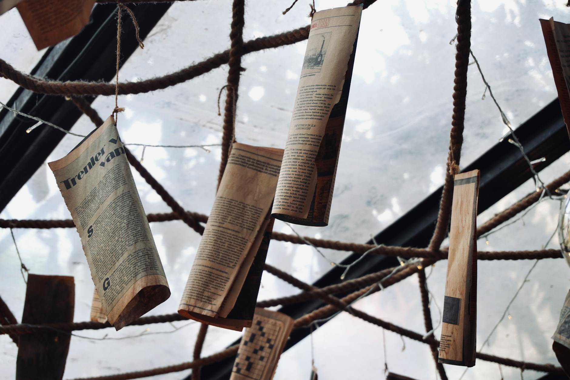 Large newspaper printing press with freshly printed newspapers coming off the production line