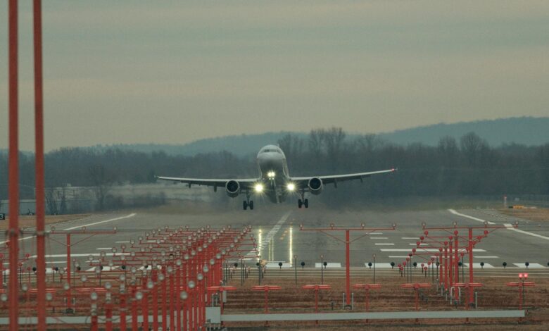 Commercial aircraft on airport runway preparing for departure