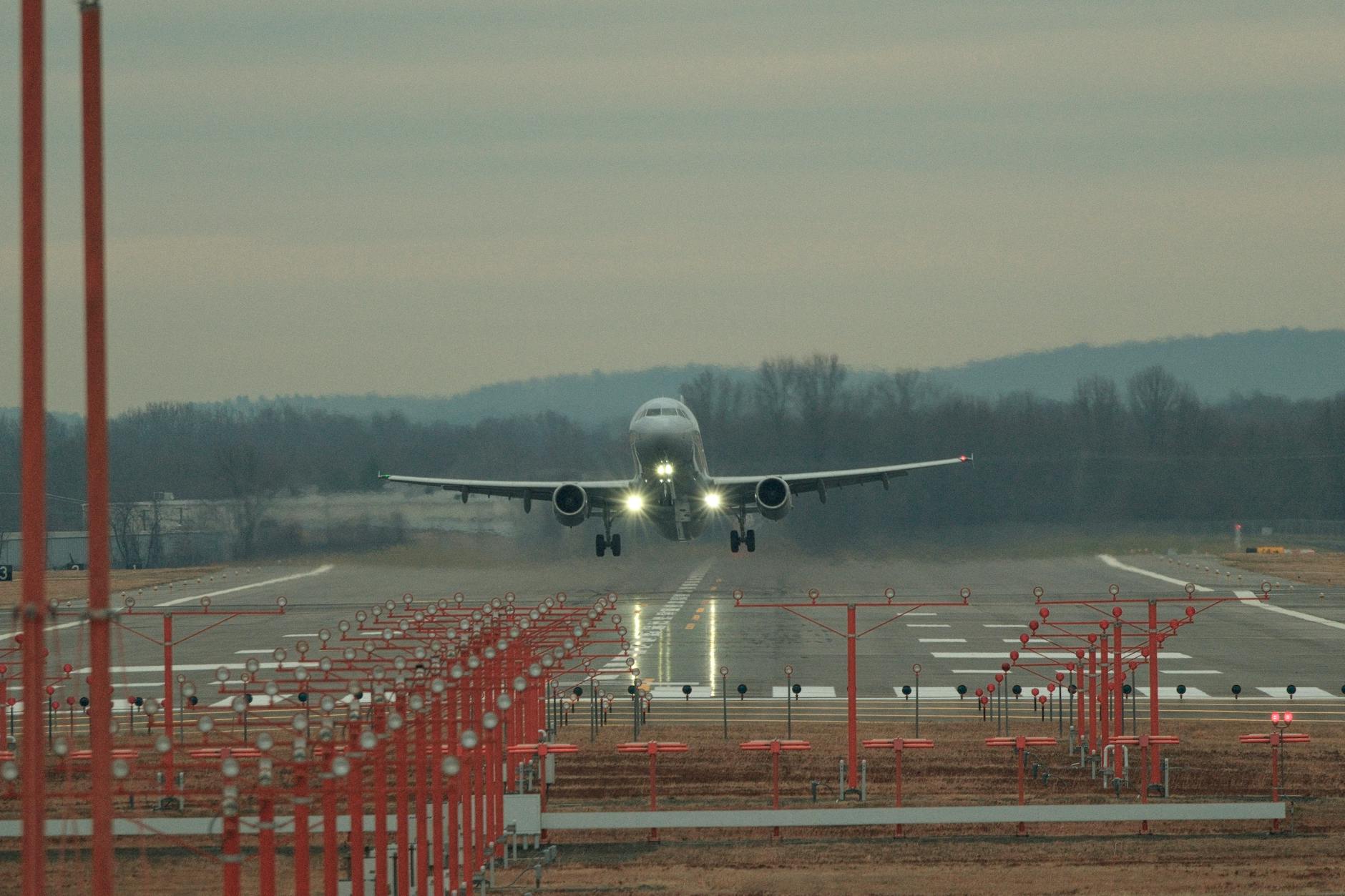 Commercial aircraft on airport runway preparing for departure