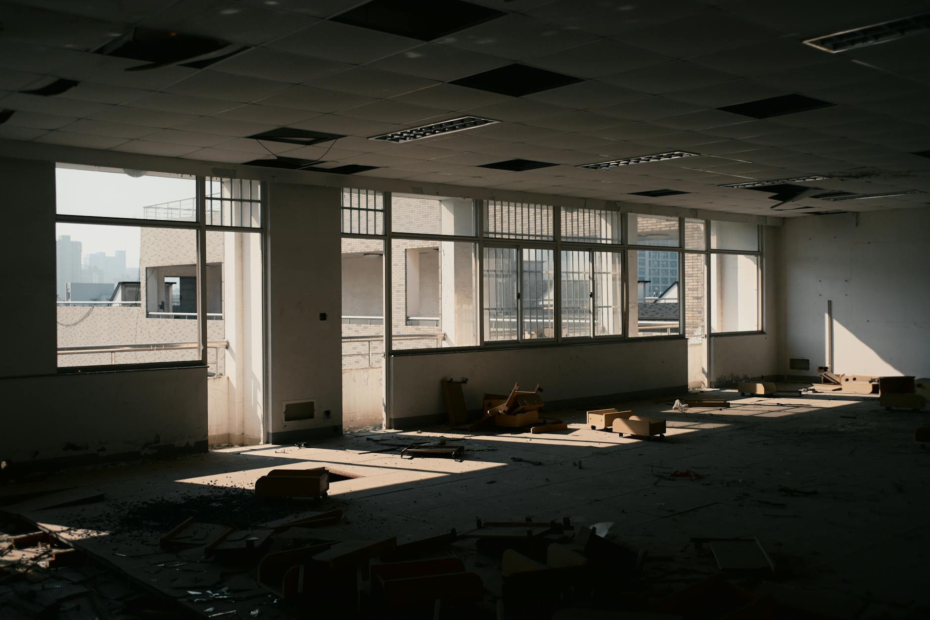 Modern office building exterior with empty windows reflecting the commercial real estate vacancy crisis
