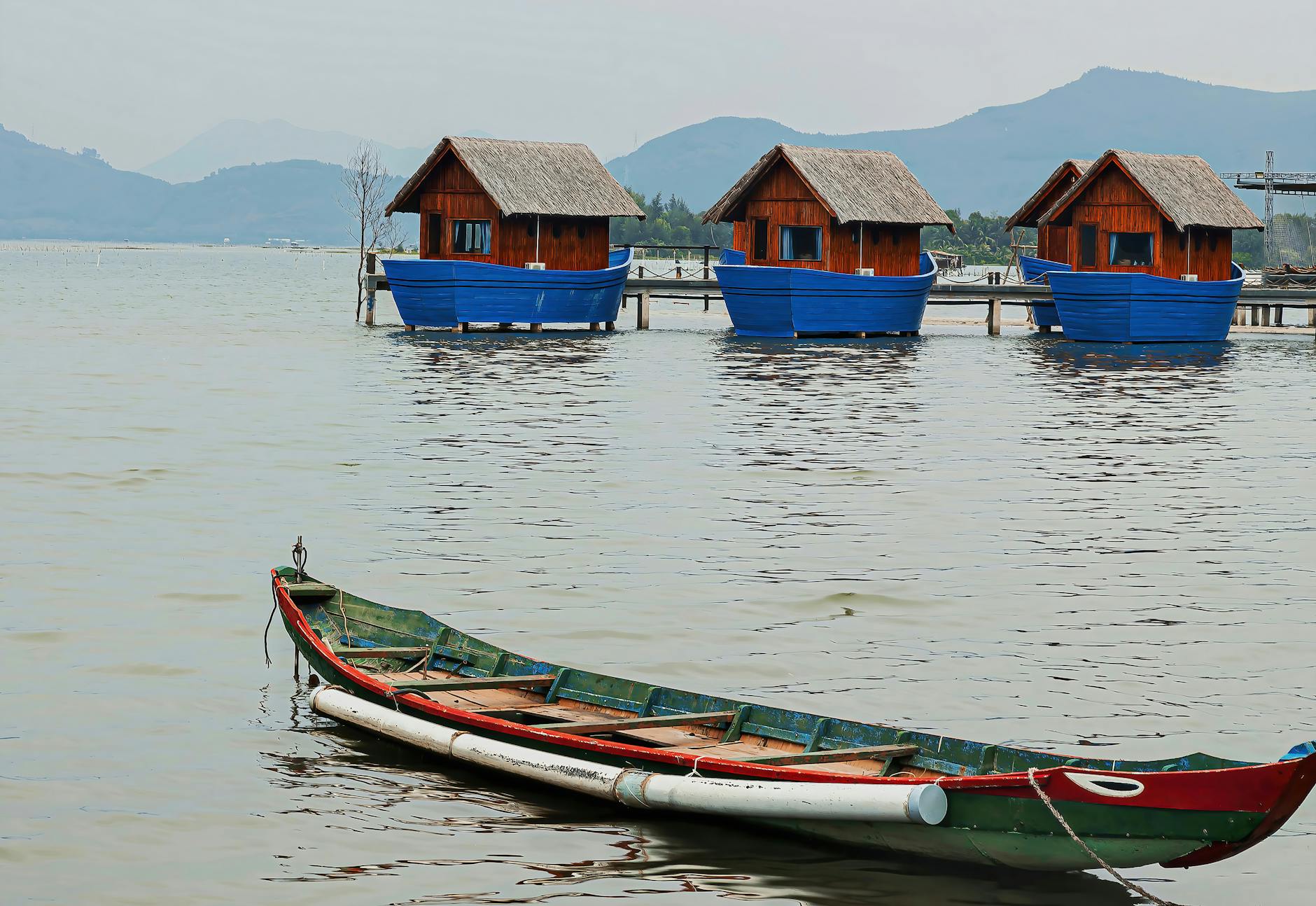 Modern floating homes on calm water with traditional architecture design