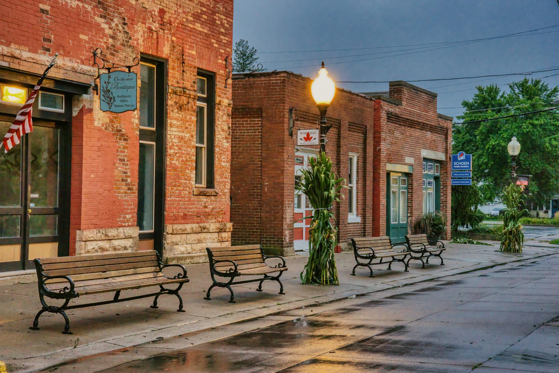 Main street of a small American town with local businesses and pedestrians
