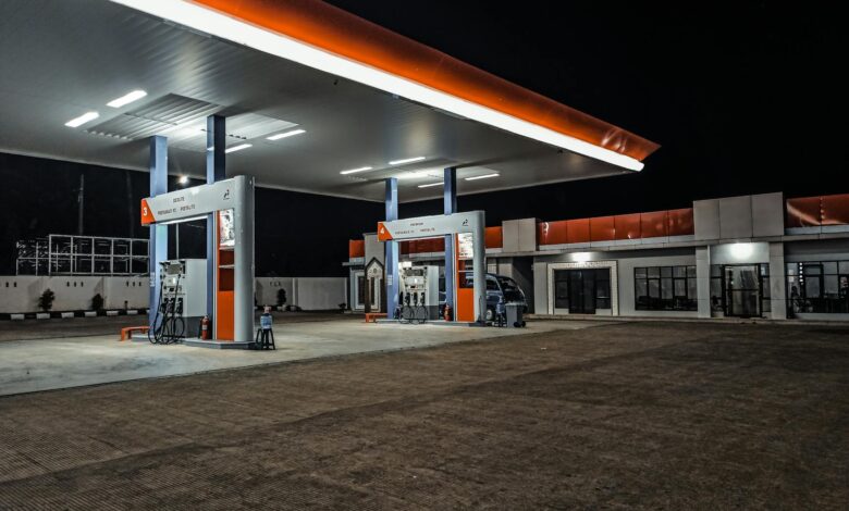 Modern gas station with fuel pumps and convenience store building