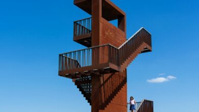 "Fire watch tower against blue sky used for bushfire monitoring and early detection"
