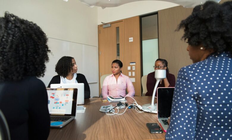 Business professionals in modern office meeting room discussing workplace policies