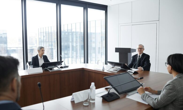 Corporate executives reviewing documents during a business strategy meeting