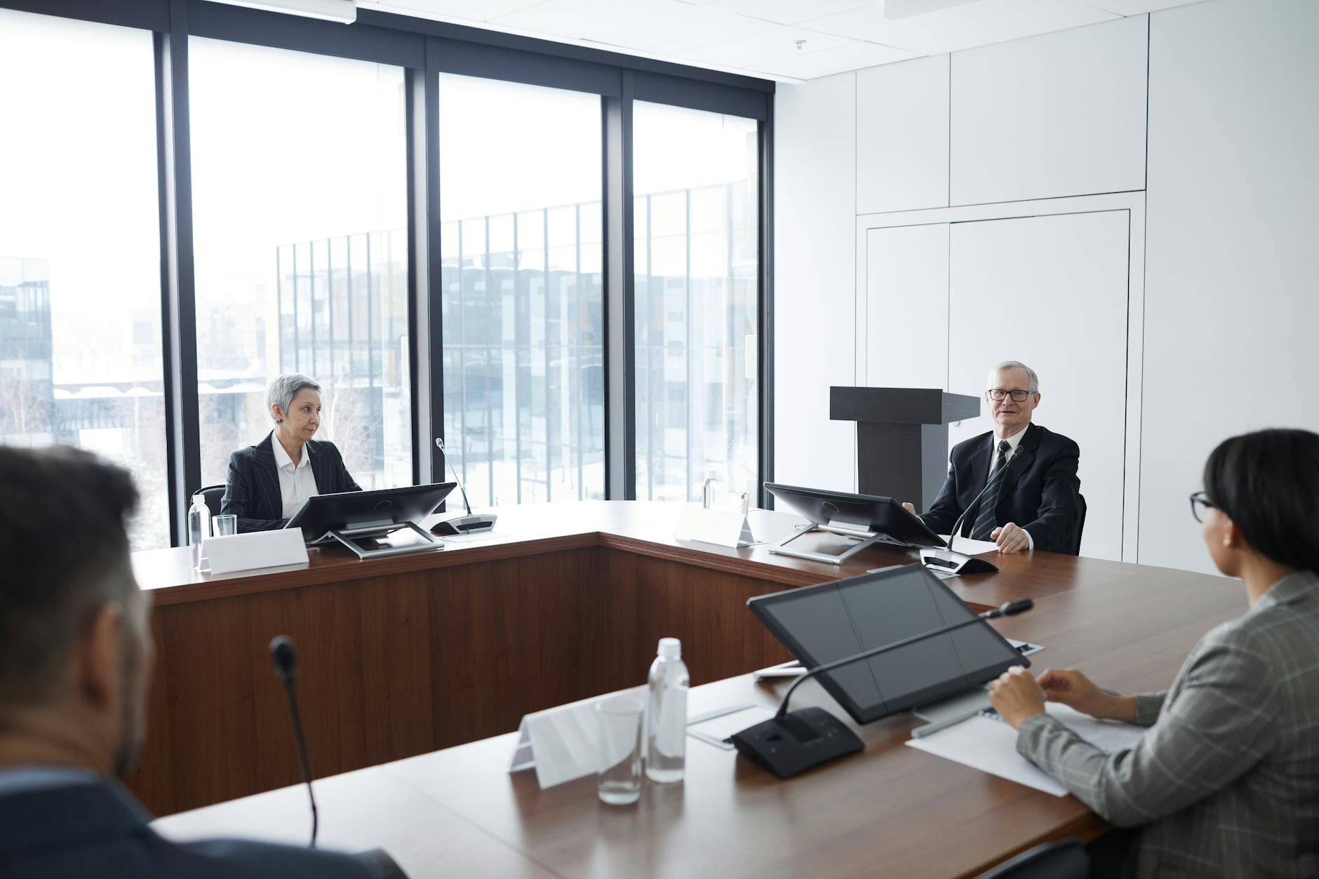 Corporate executives reviewing documents during a business strategy meeting