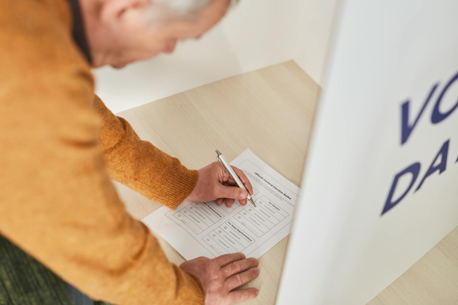 Person casting ballot in voting booth representing changing electoral patterns