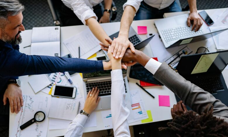 Group of diverse professionals collaborating around a conference table in a modern office setting