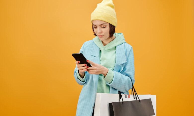 Person using smartphone for mobile shopping and e-commerce