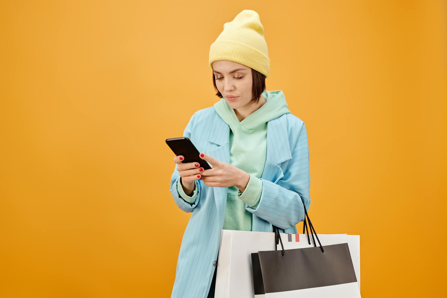 Person using smartphone for mobile shopping and e-commerce