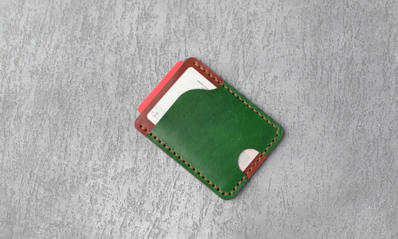 Multiple credit cards arranged in a leather wallet showing various bank logos and card designs
