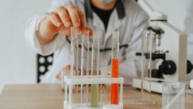 Scientists working in pharmaceutical research laboratory with equipment and test tubes
