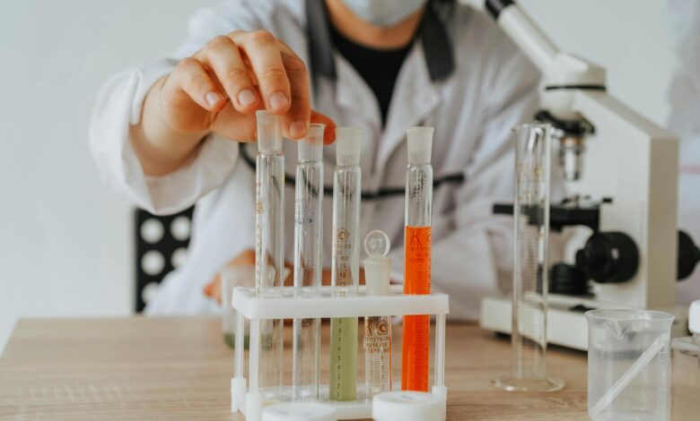 Scientists working in pharmaceutical research laboratory with equipment and test tubes