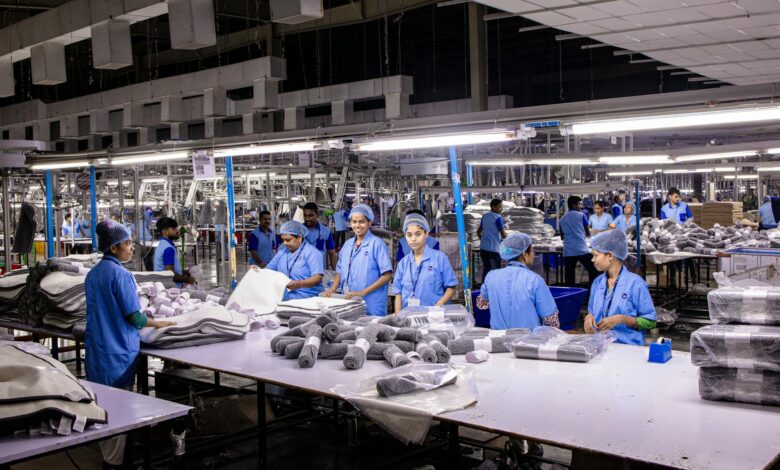 Modern manufacturing facility with automated production equipment and workers