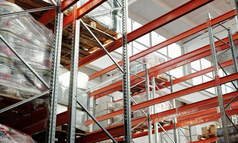 Modern warehouse interior with automated systems and conveyor belts showing retail fulfillment operations