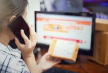 Person using smartphone for online shopping, representing mobile commerce integration