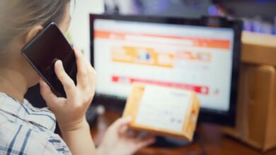 Person using smartphone for online shopping, representing mobile commerce integration