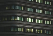 Modern corporate office building with glass facade representing return-to-office mandates