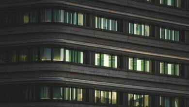 Modern corporate office building with glass facade representing return-to-office mandates