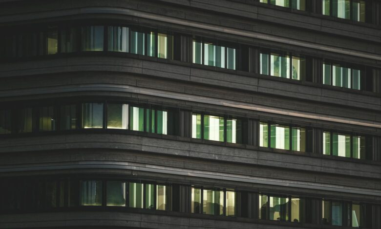 Modern corporate office building with glass facade representing return-to-office mandates