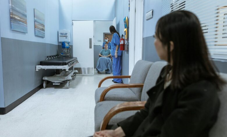 Modern hospital corridor with medical equipment and clean white walls