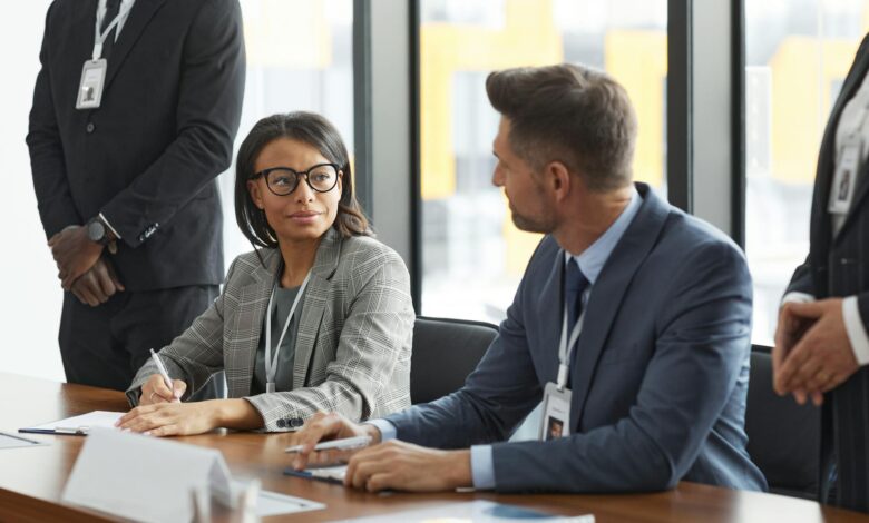 Corporate executives in a boardroom meeting discussing strategy and policy decisions
