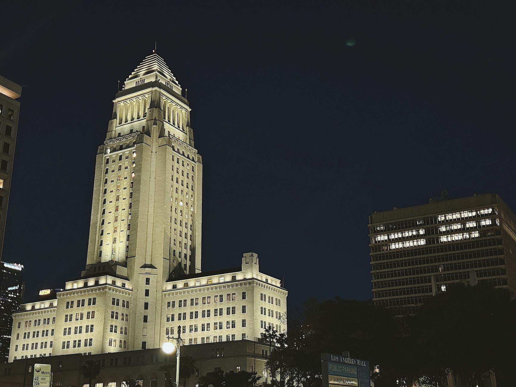 Modern city hall building with glass facade and columns representing local government power
