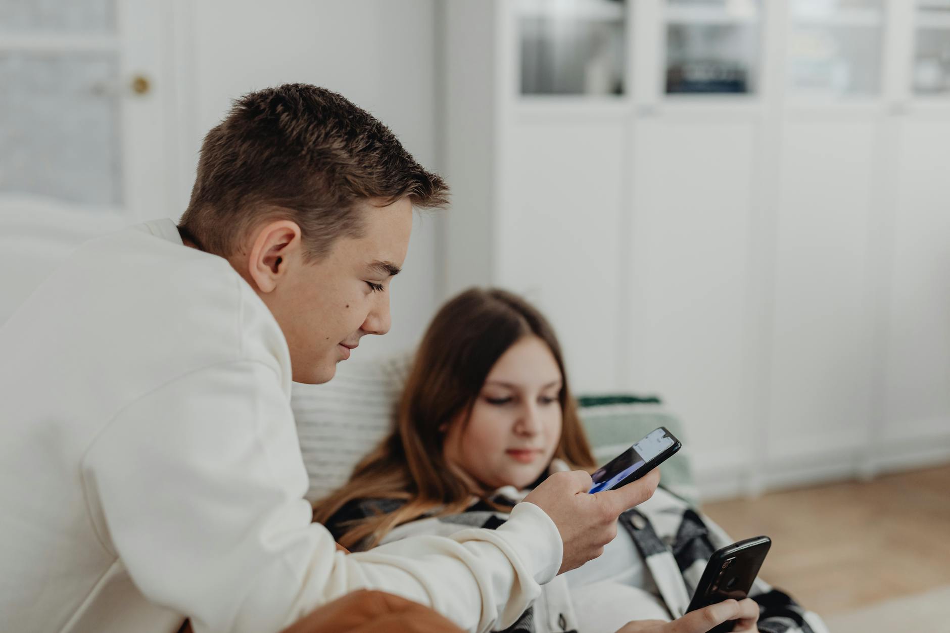 Group of young people looking at smartphones and social media