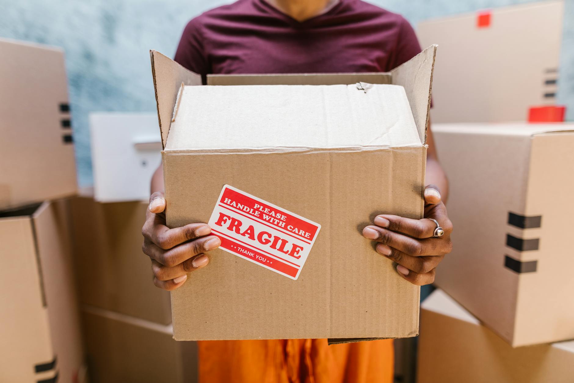 Cardboard moving boxes stacked inside an empty residential home