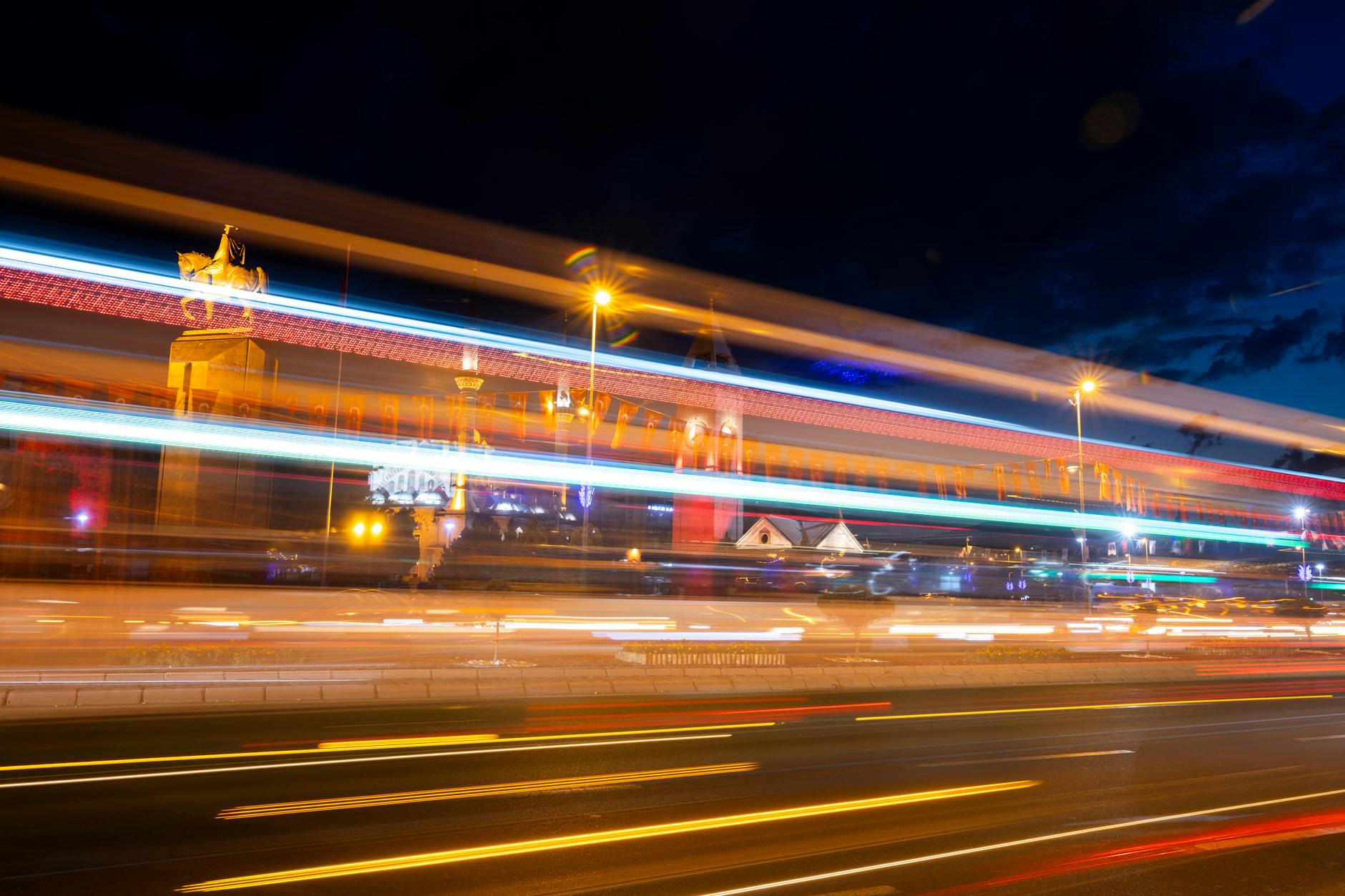Night view of urban traffic with cars on city streets