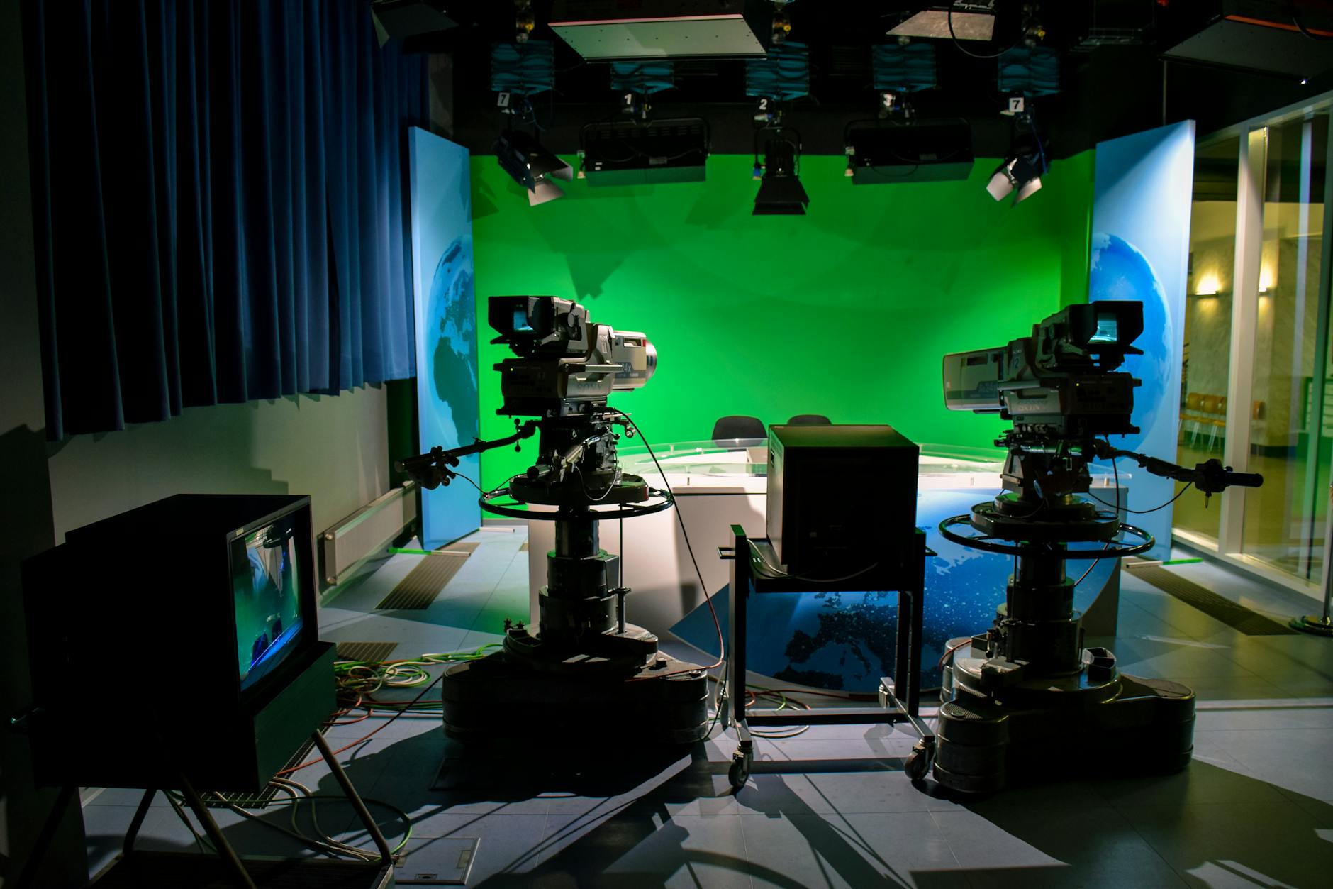 Professional television studio setup with bright studio lights and camera equipment for live broadcasting