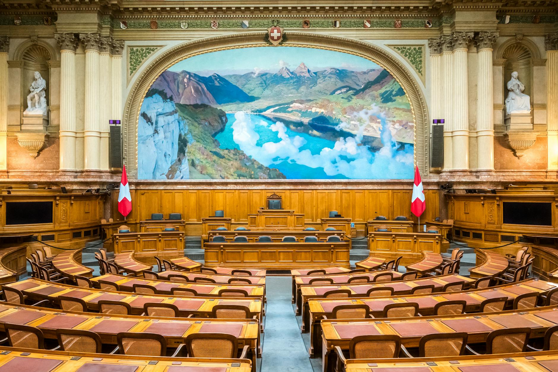 Municipal government meeting with elected officials seated at council chamber desks