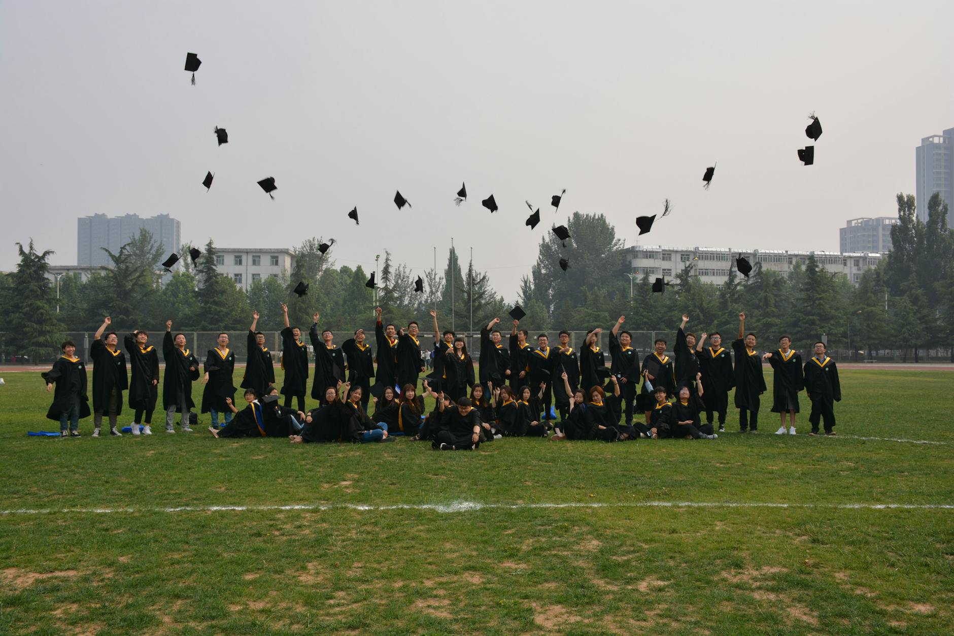 College graduates in caps and gowns at commencement ceremony